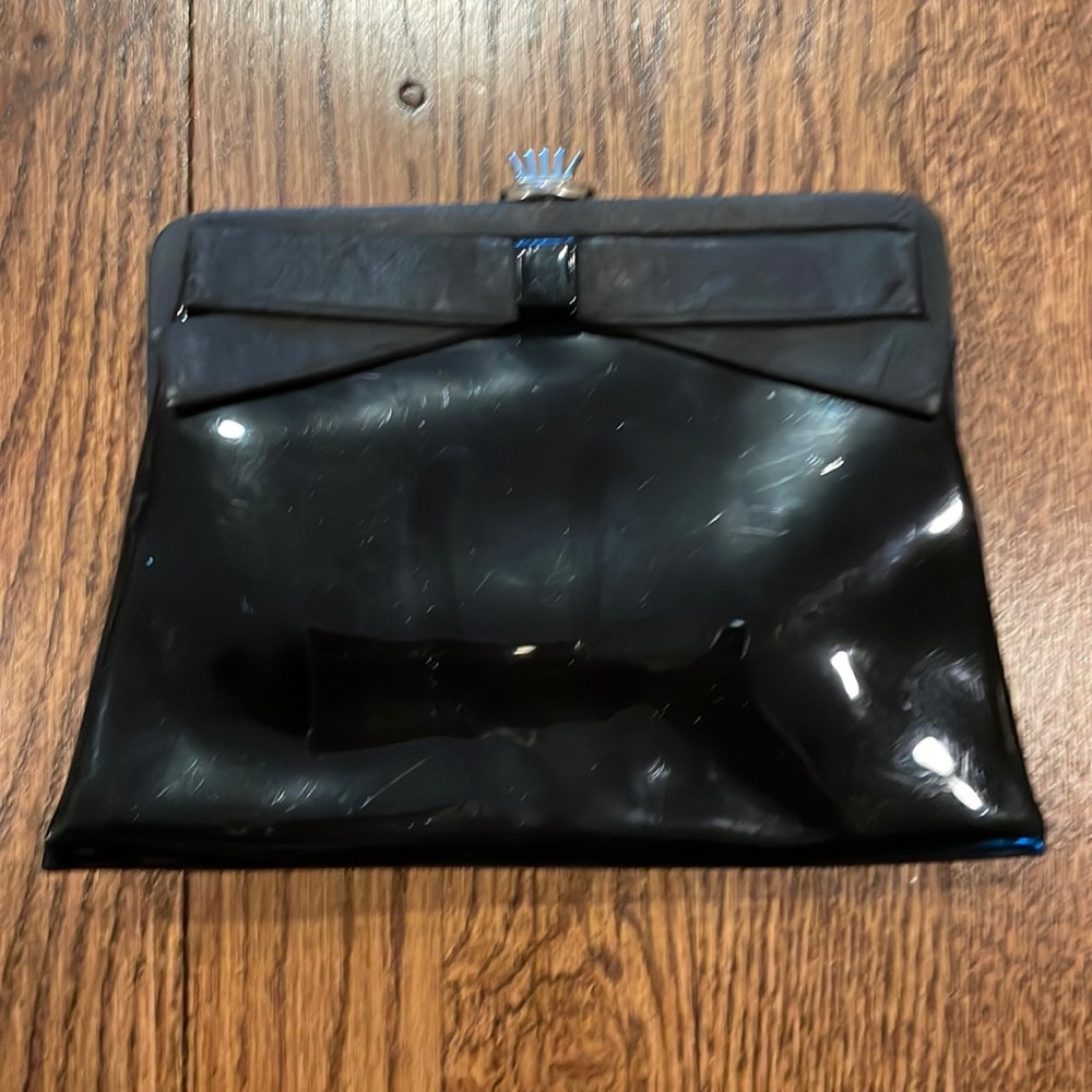 Vintage Black patent leather clutch with bow and gold clasp.